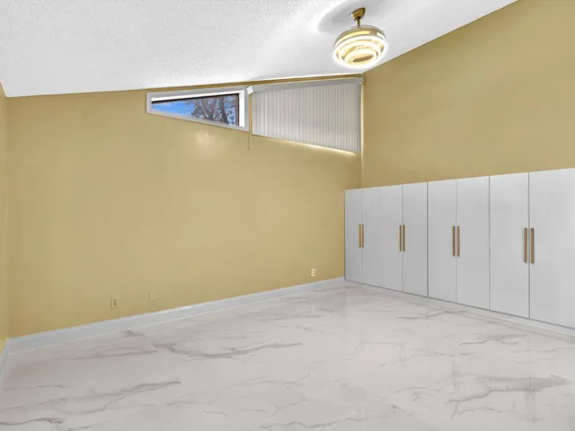 a bathroom with a shower sink and mirror