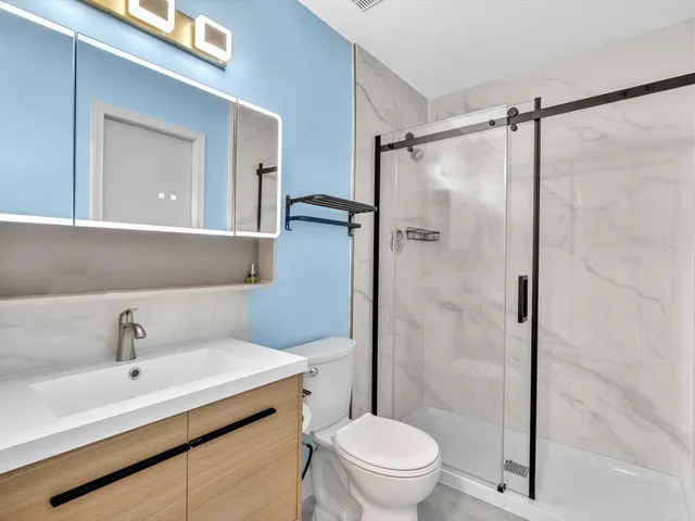 a view of a room with wooden floor and window
