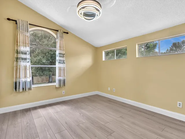 an aerial view of residential building and ocean