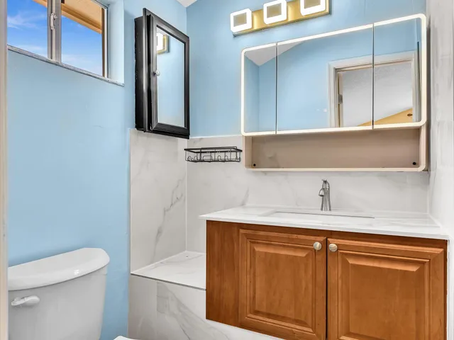 a view of a backyard with sitting area