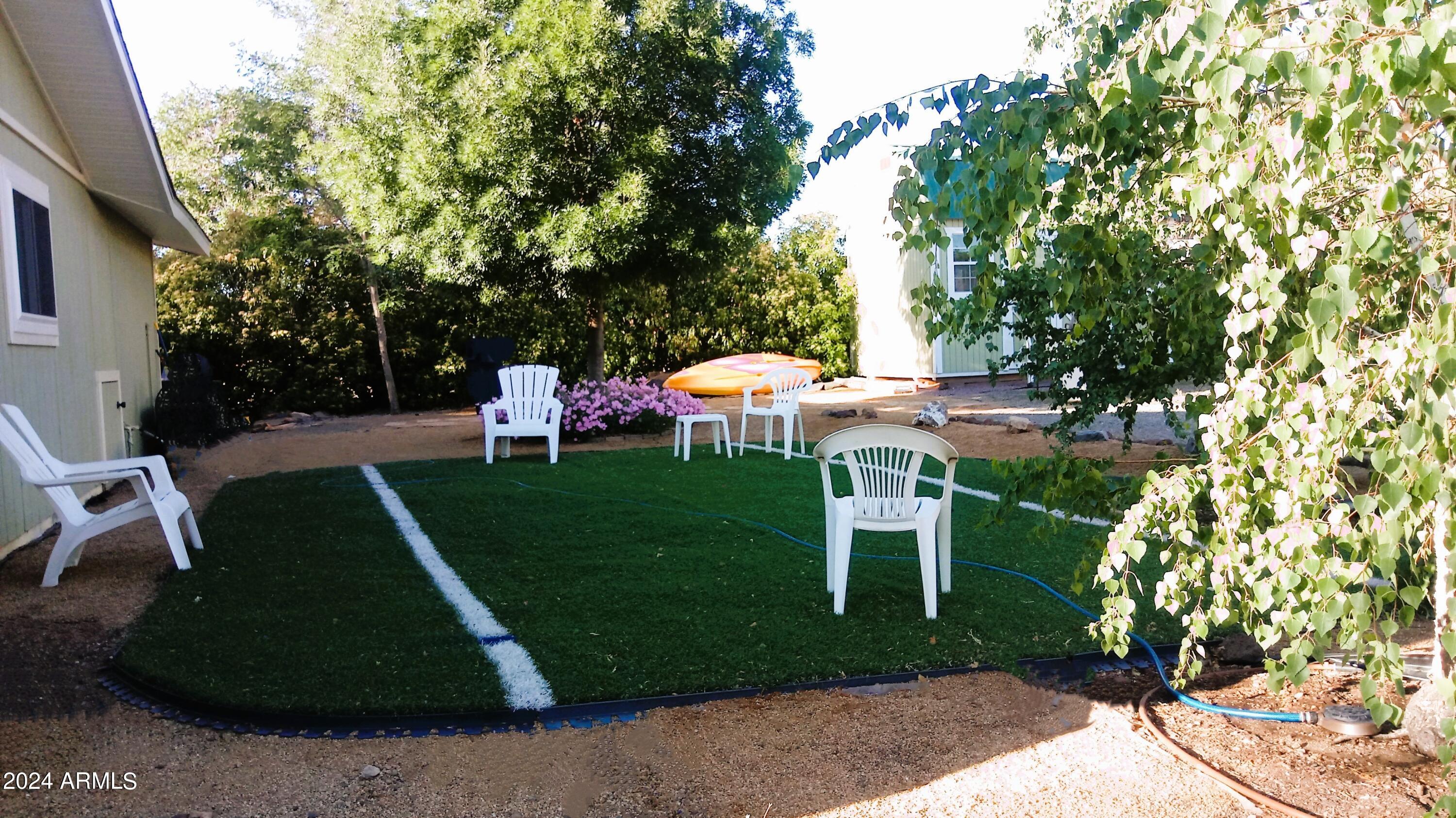 3442 North Tower Road Prescott Valley, AZ 86314 - Photo 44 of 64 Backyard Grass area south facing- Summer