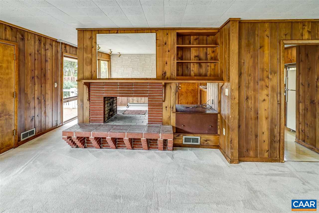 1159 Wolf Trap Road Charlottesville, VA 22911 - Photo 10 of 50 an empty room with a fireplace and cabinet