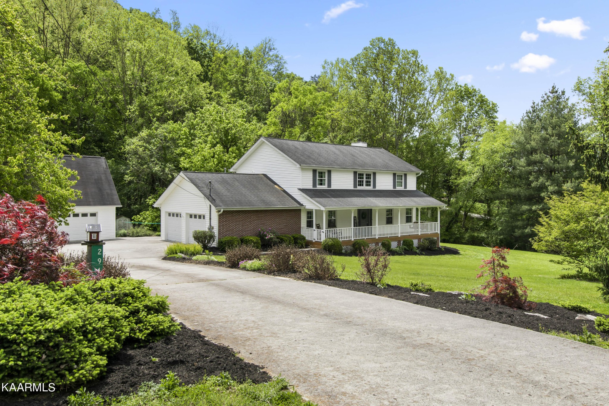 291 Lone Ridge Lane Clinton, TN 37716 - Photo 1 of 30 a front view of a house with a garden