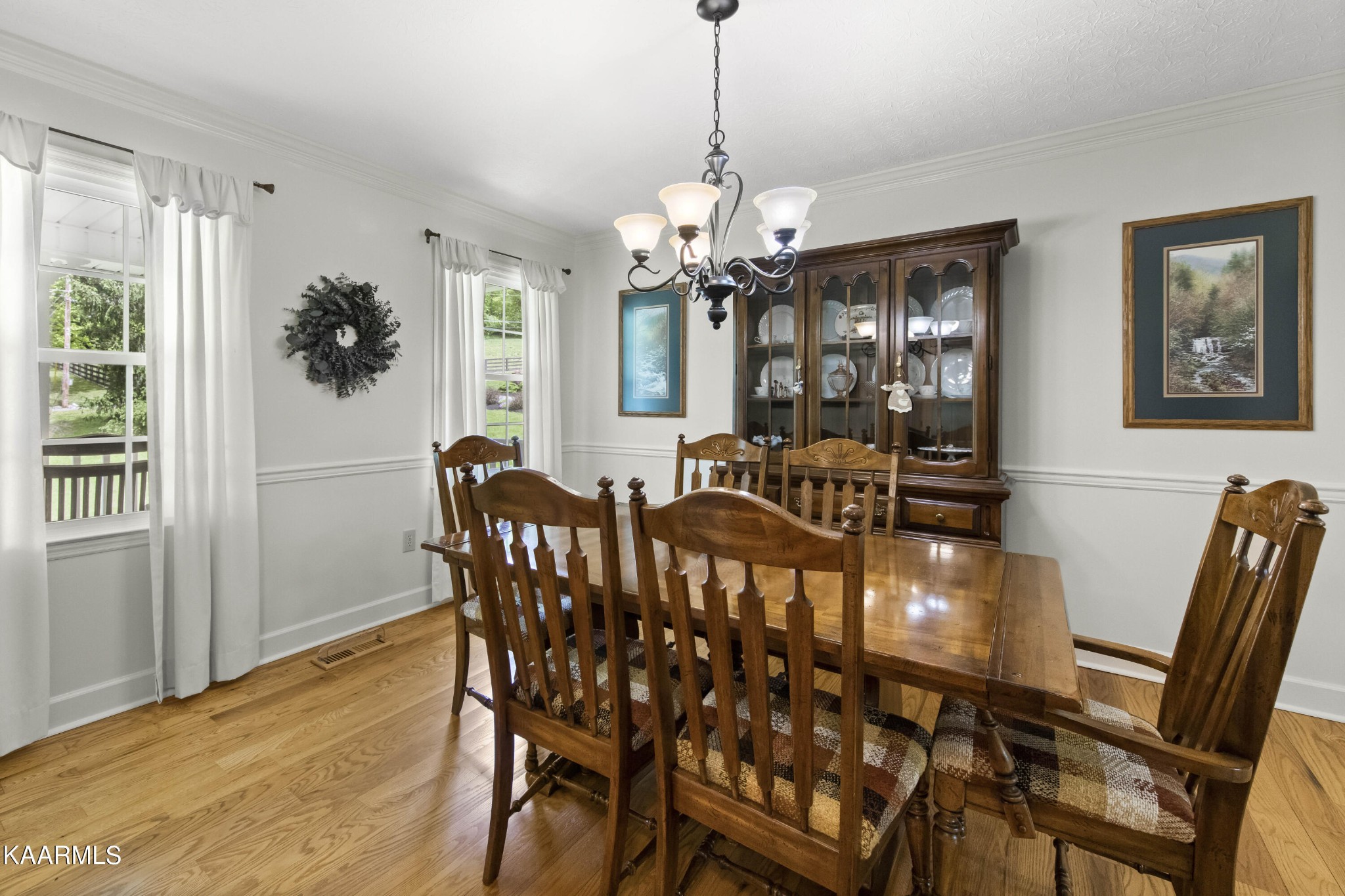 291 Lone Ridge Lane Clinton, TN 37716 - Photo 11 of 30 a view of a dining room with furniture and chandelier