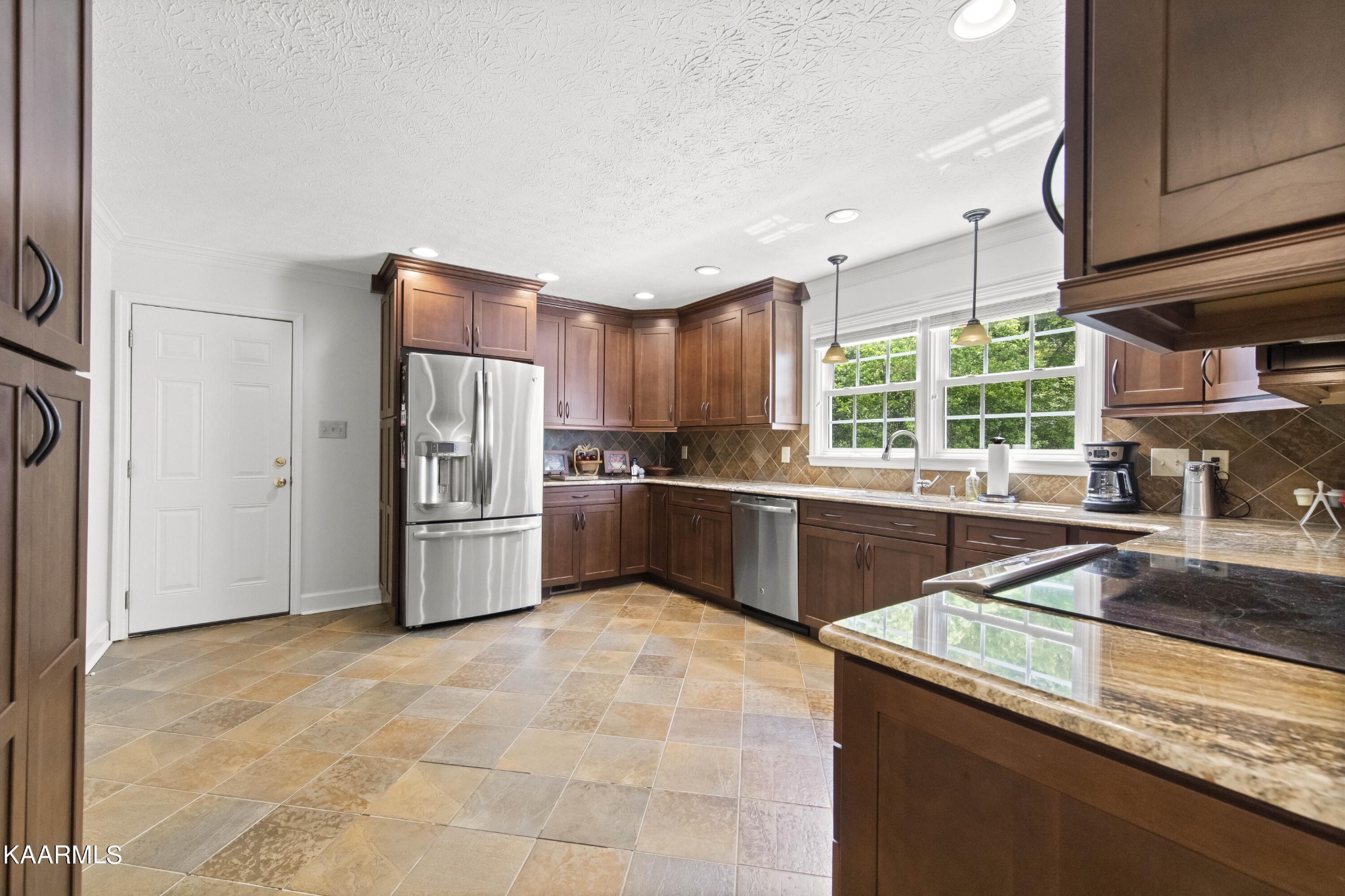 291 Lone Ridge Lane Clinton, TN 37716 - Photo 14 of 30 a kitchen with a sink a counter top space cabinets and stainless steel appliances