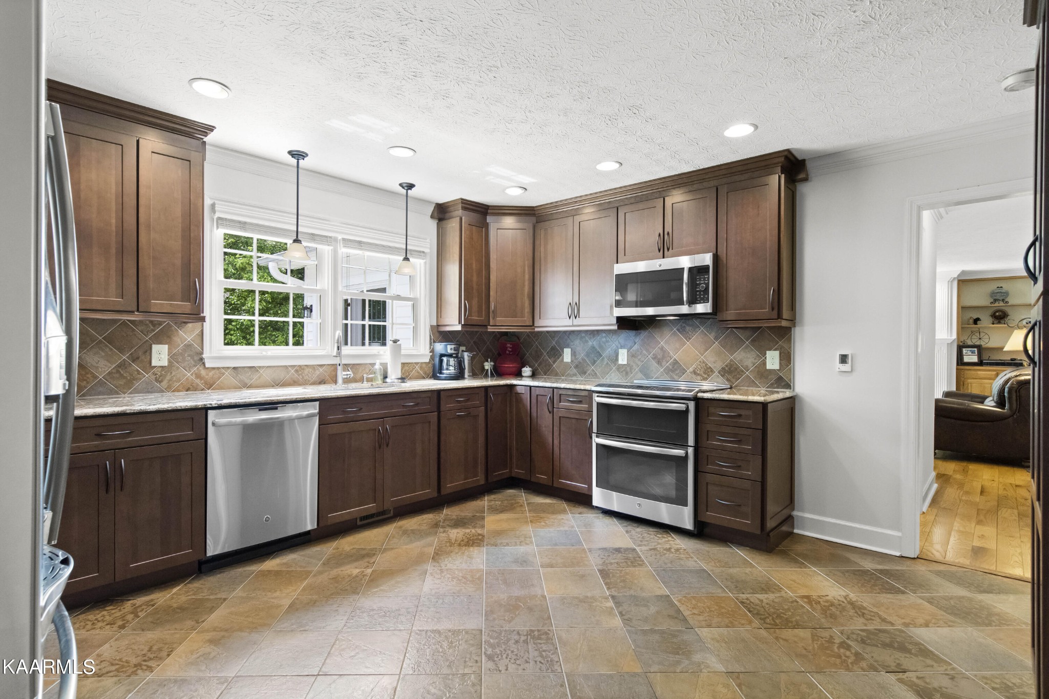291 Lone Ridge Lane Clinton, TN 37716 - Photo 15 of 30 a kitchen with a stove a sink and a refrigerator