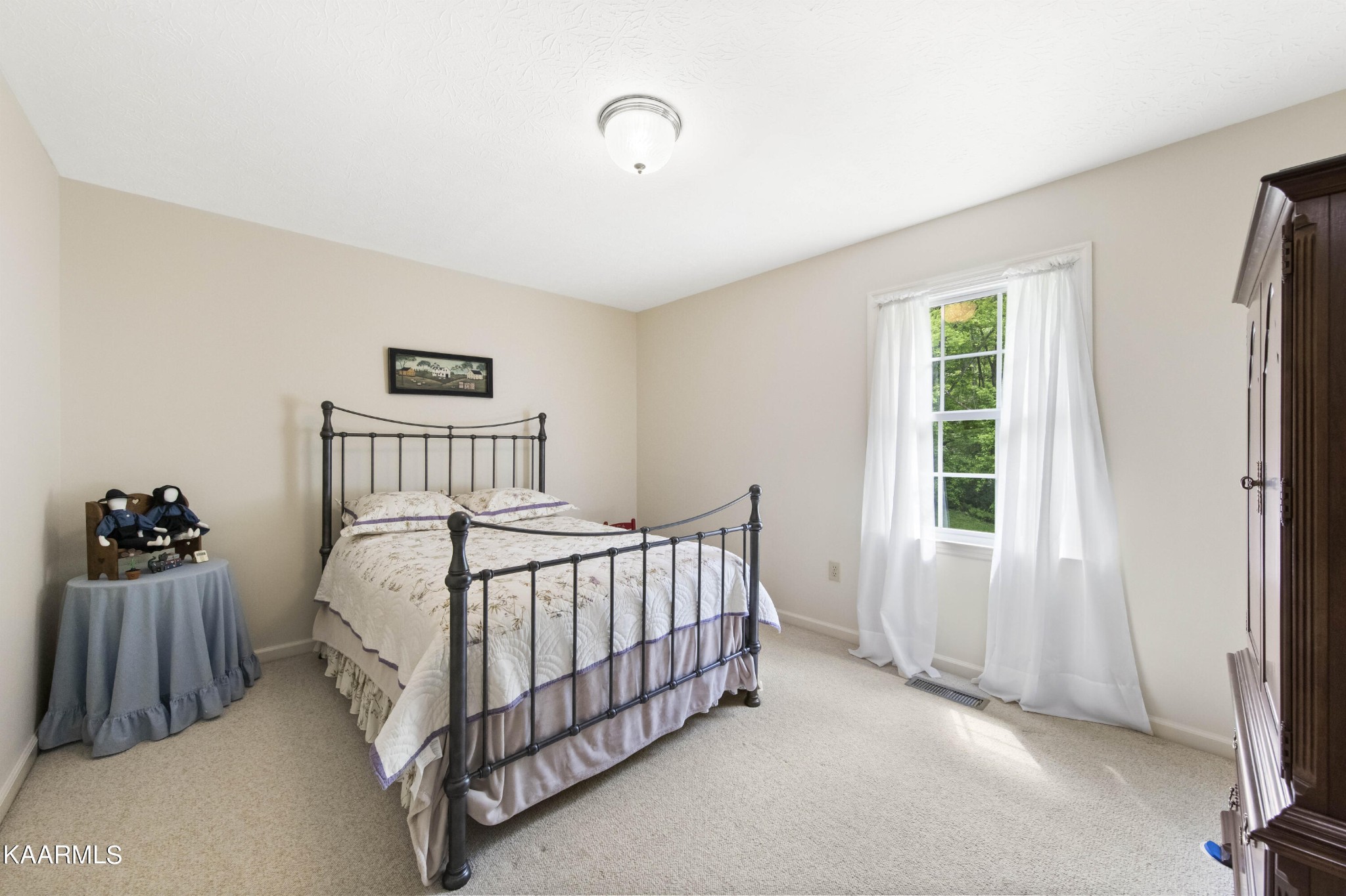291 Lone Ridge Lane Clinton, TN 37716 - Photo 19 of 30 a bedroom with a bed and a window