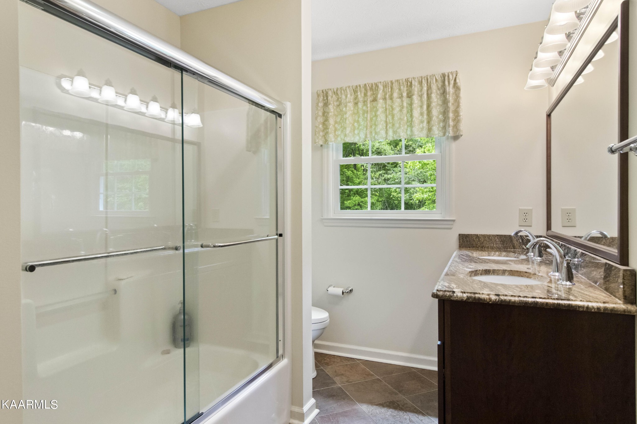 291 Lone Ridge Lane Clinton, TN 37716 - Photo 20 of 30 a bathroom with a double vanity sink mirror and shower