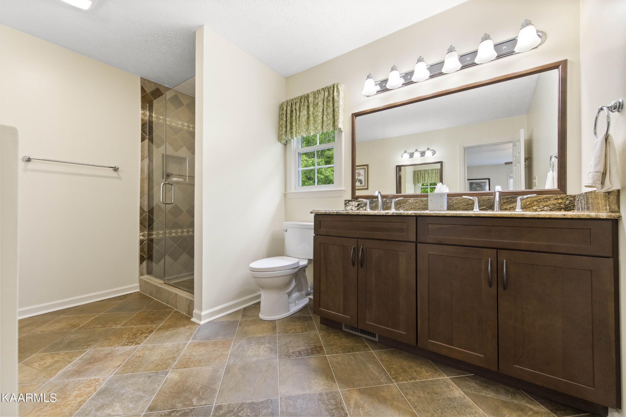 291 Lone Ridge Lane Clinton, TN 37716 - Photo 23 of 30 a bathroom with a sink mirror and toilet