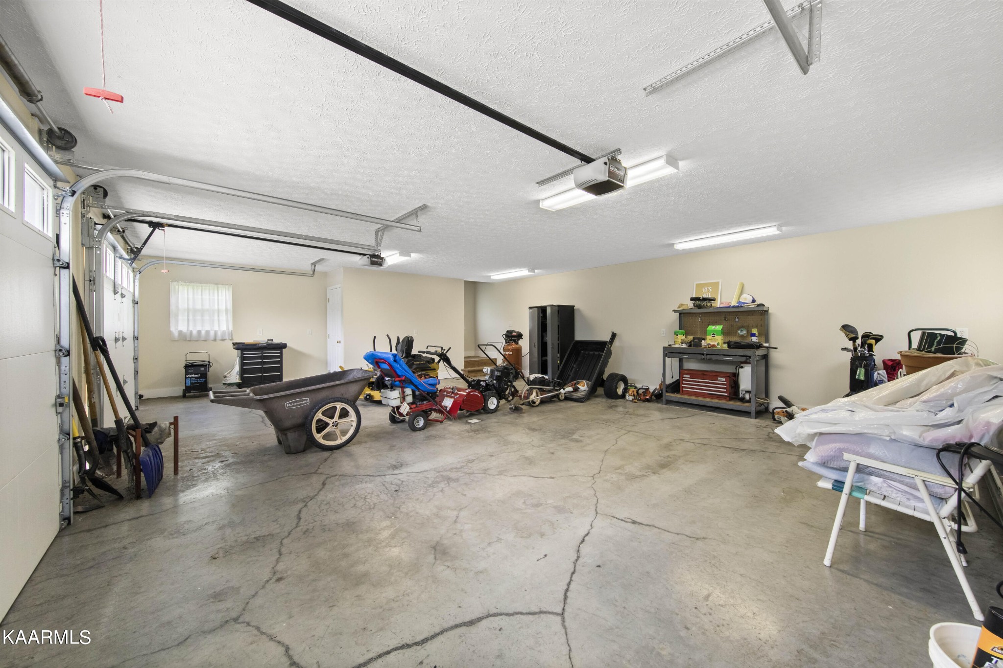291 Lone Ridge Lane Clinton, TN 37716 - Photo 25 of 30 a view of a garage with parked cars