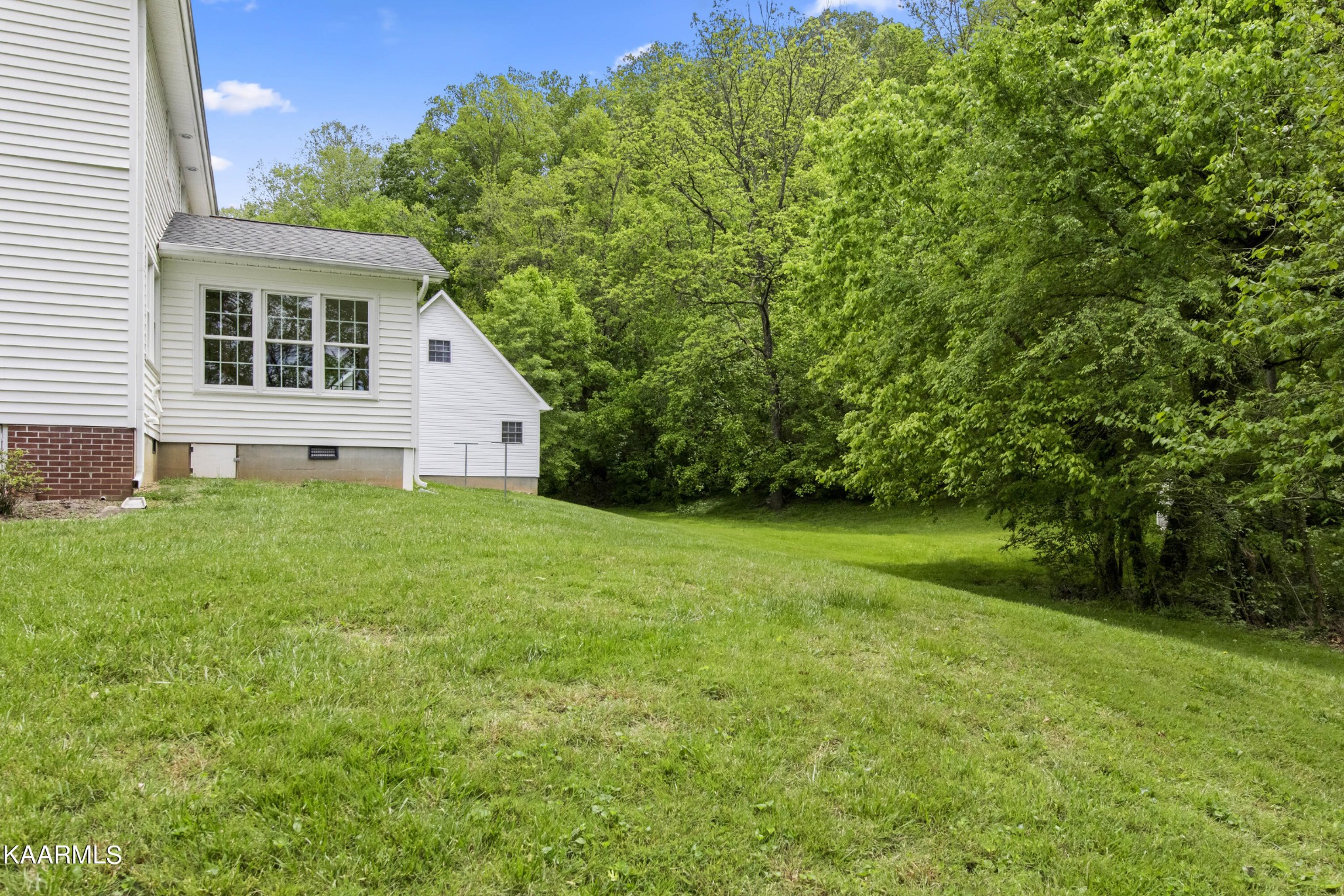 291 Lone Ridge Lane Clinton, TN 37716 - Photo 29 of 30 a house view with a garden space