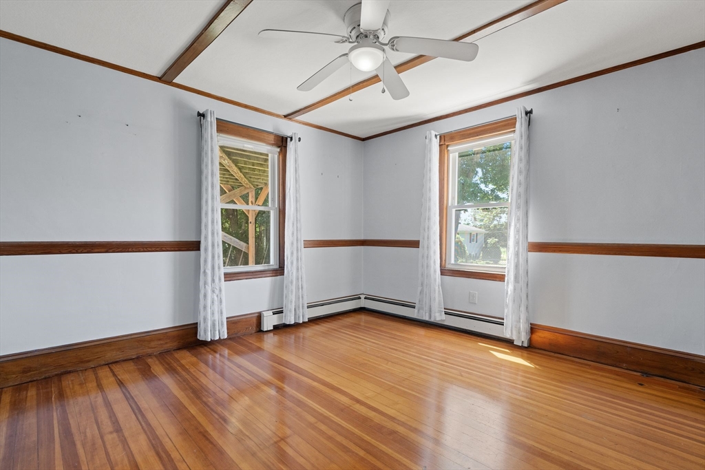 7 Carter Road Braintree, MA 02184 - Photo 11 of 42 an empty room with wooden floor and windows