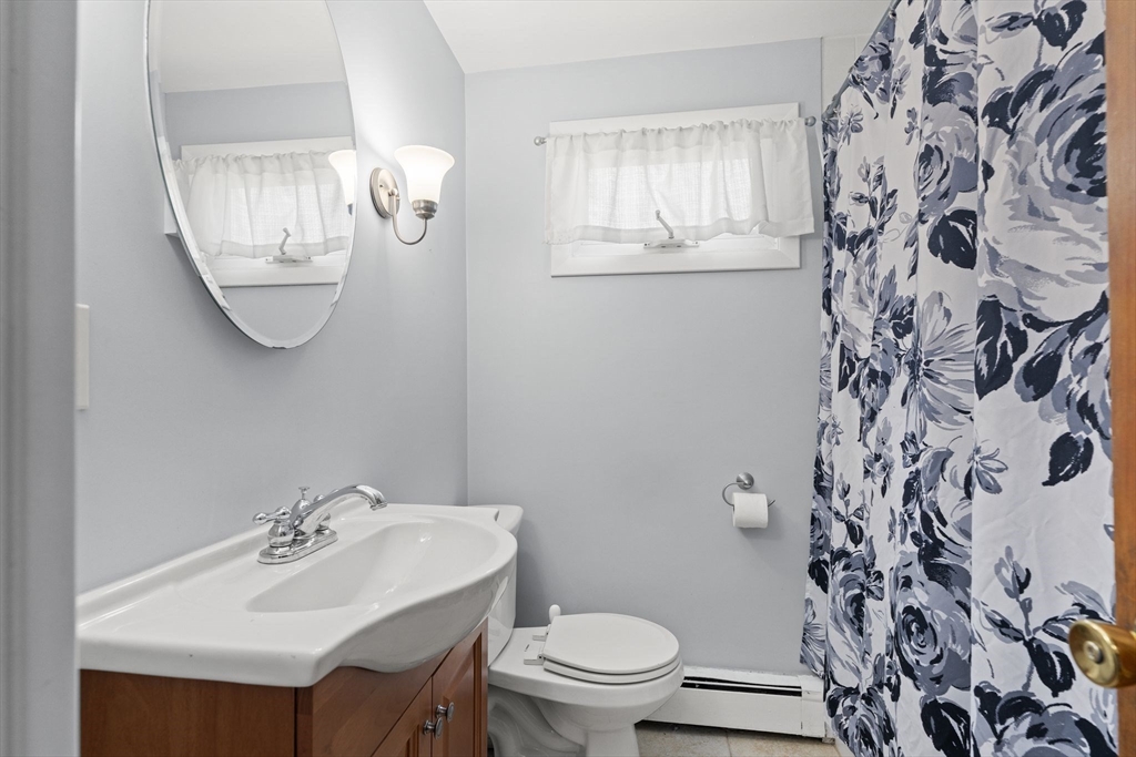 7 Carter Road Braintree, MA 02184 - Photo 12 of 42 a bathroom with a toilet sink and mirror