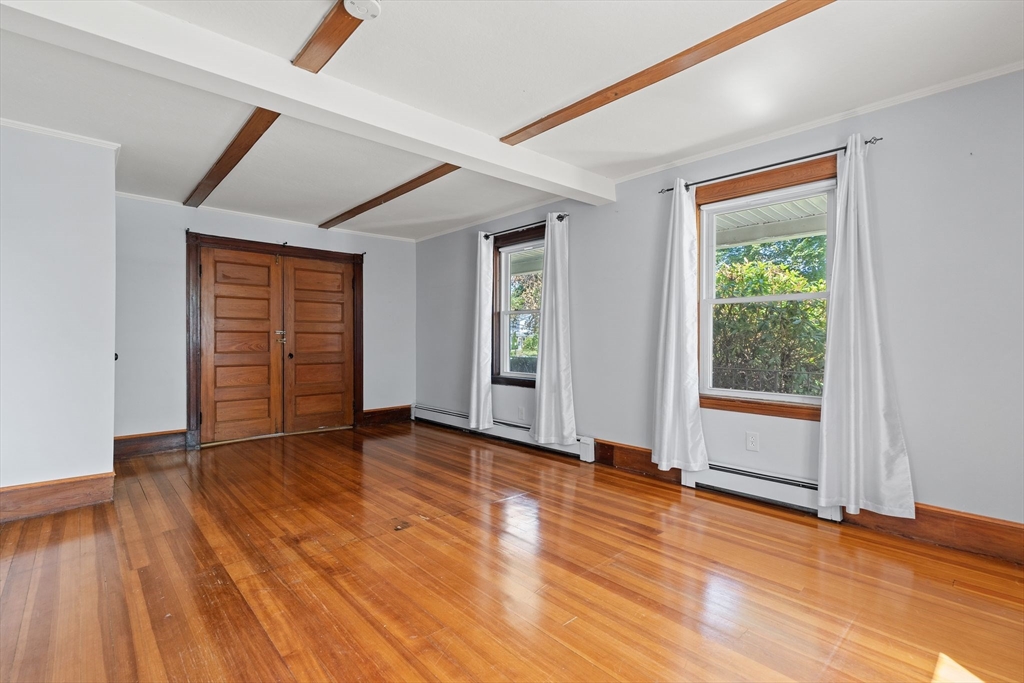7 Carter Road Braintree, MA 02184 - Photo 13 of 42 an empty room with wooden floor and windows