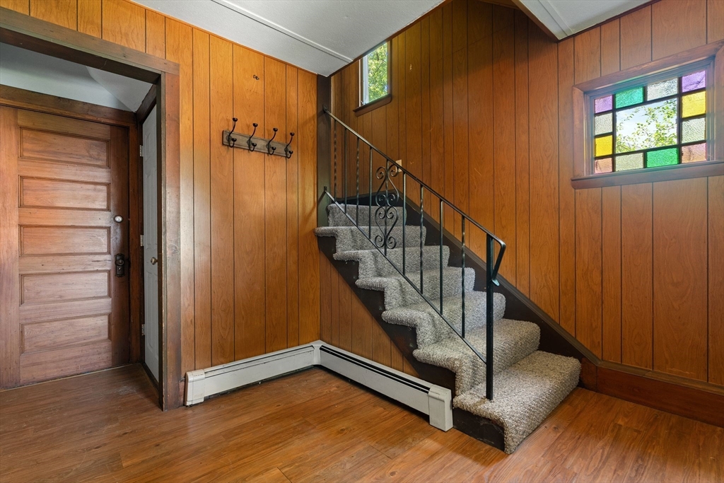 7 Carter Road Braintree, MA 02184 - Photo 17 of 42 a view of entryway with wooden floor and stairs