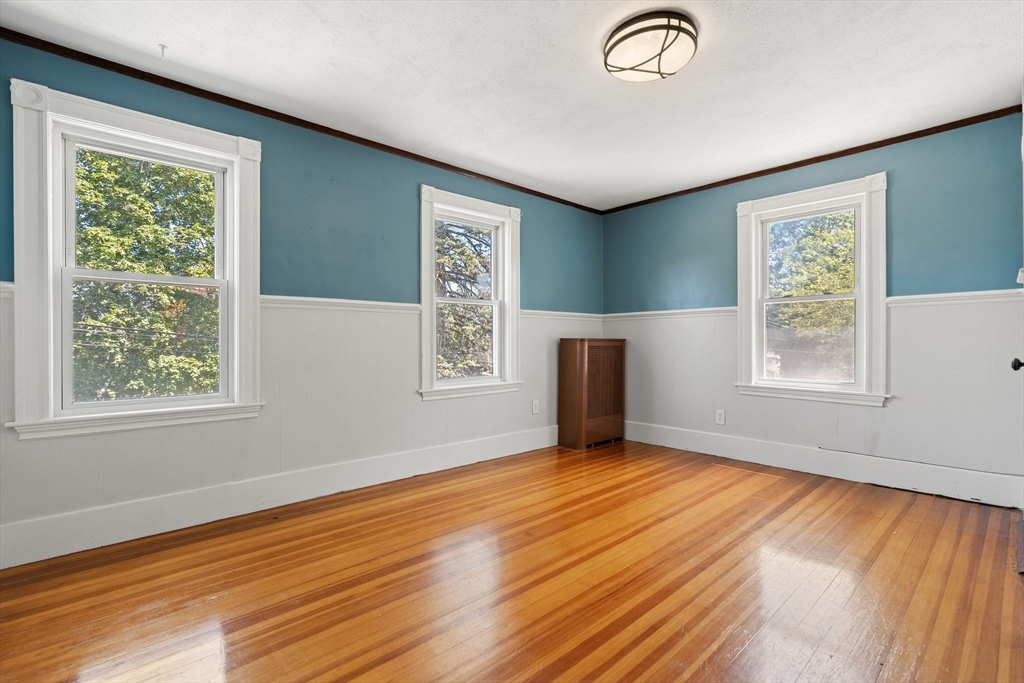 7 Carter Road Braintree, MA 02184 - Photo 25 of 42 a view of an empty room with wooden floor and a window