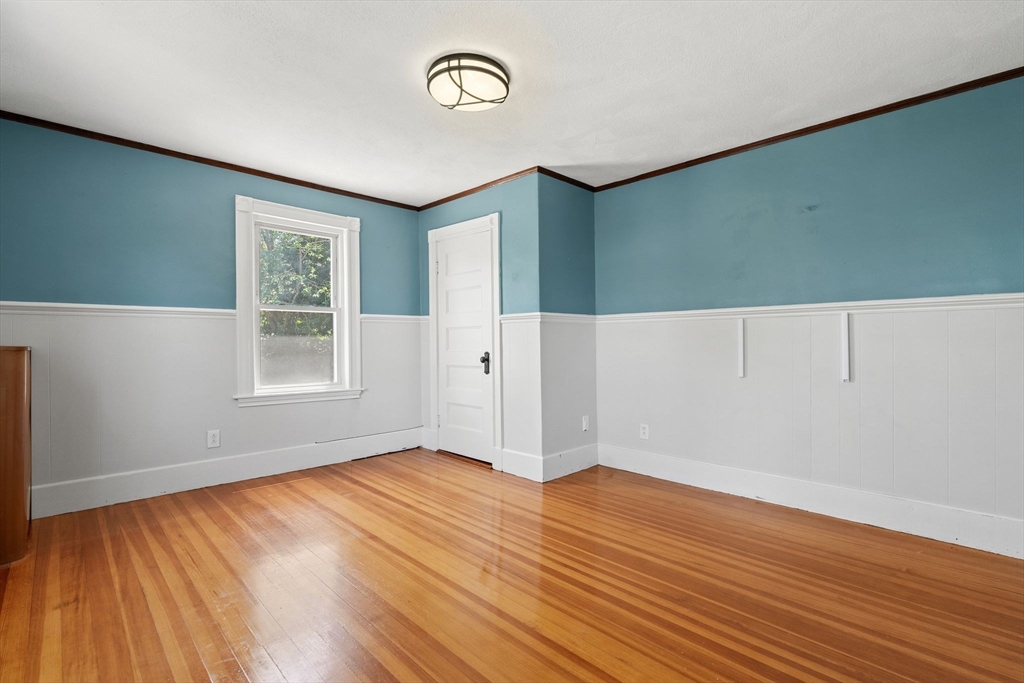 7 Carter Road Braintree, MA 02184 - Photo 26 of 42 an empty room with wooden floor and windows