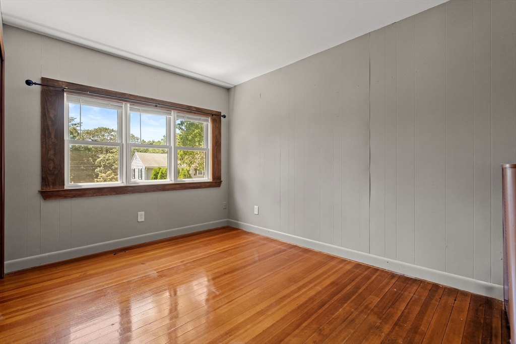7 Carter Road Braintree, MA 02184 - Photo 27 of 42 a view of an empty room with wooden floor and a window