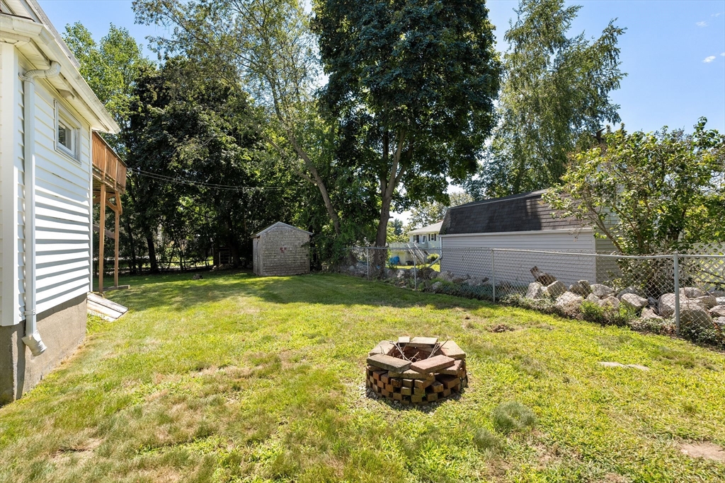 7 Carter Road Braintree, MA 02184 - Photo 40 of 42 a front view of house with yard and trees