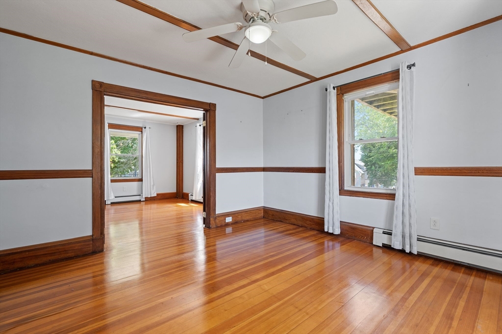 7 Carter Road Braintree, MA 02184 - Photo 10 of 42 a view of an empty room with wooden floor and a window