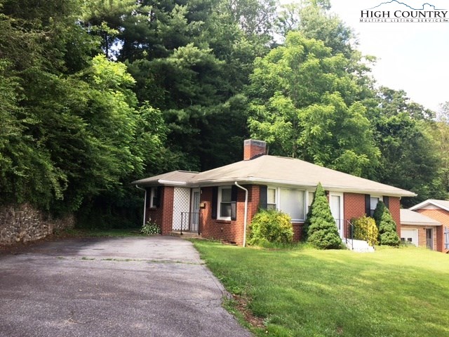 501 Oak Street Boone, NC 28607 - Photo 1 of 12 a front view of a house with yard and green space