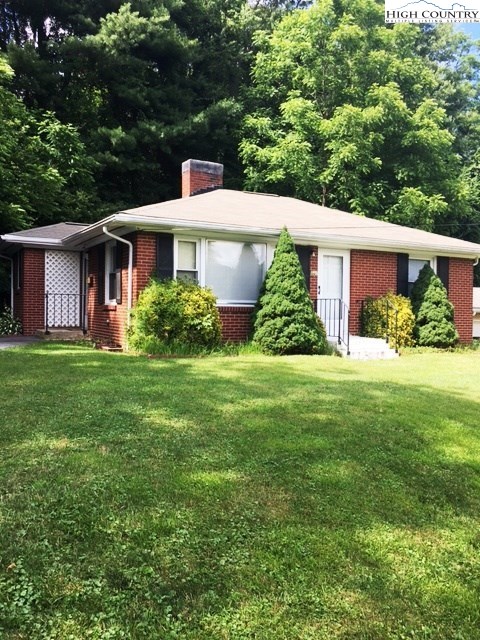 501 Oak Street Boone, NC 28607 - Photo 11 of 12 a front view of a house with garden