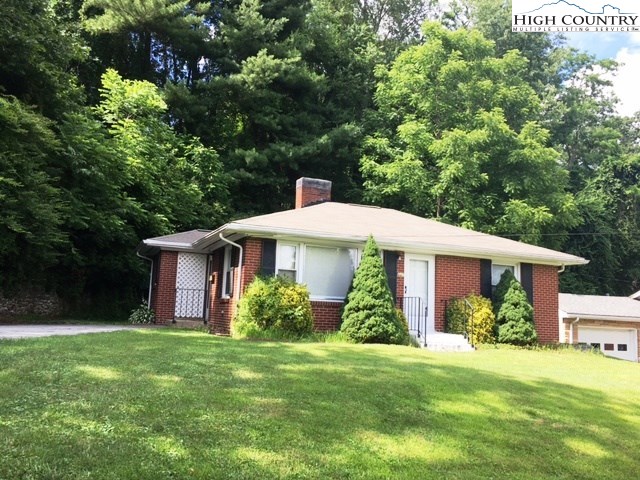 501 Oak Street Boone, NC 28607 - Photo 2 of 12 a front view of a house with garden