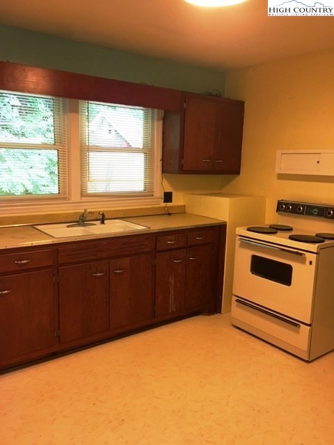 501 Oak Street Boone, NC 28607 - Photo 4 of 12 a kitchen with a sink and a stove
