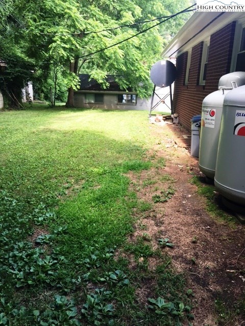 501 Oak Street Boone, NC 28607 - Photo 10 of 12 a view of a backyard with large trees