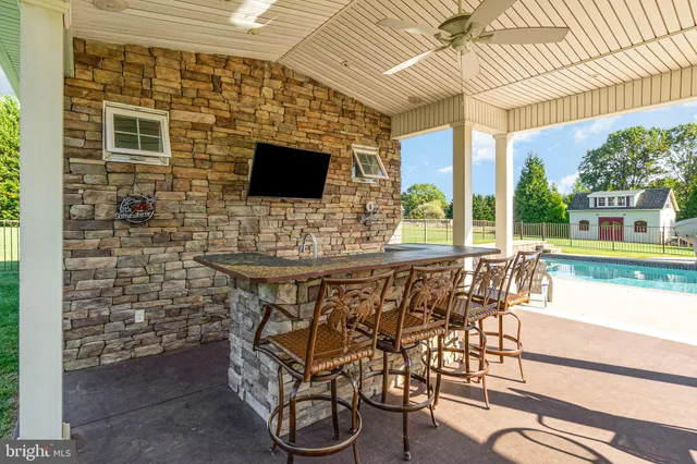 a view of an outdoor dining space with furniture