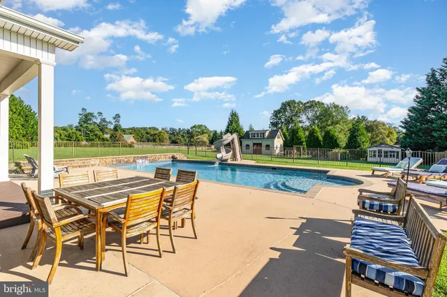 a kitchen with granite countertop a sink cabinets and window