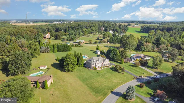 an aerial view of a houses with outdoor space