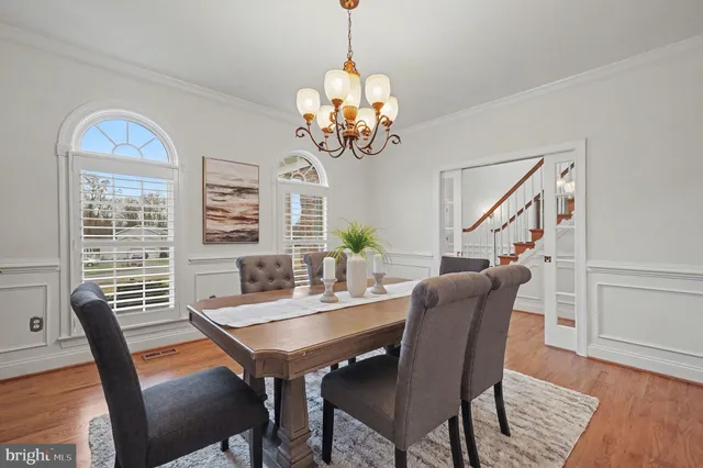 an aerial view of a house with a yard and plants