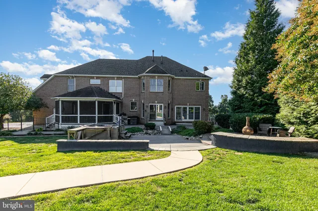 a view of a patio with table and chairs potted plants with wooden floor