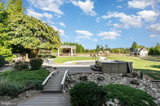 a view of a porch with a table and chairs