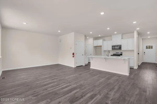 a view of kitchen with wooden floor