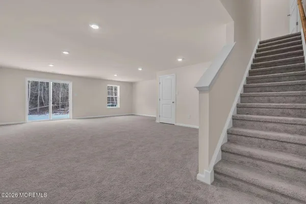 a view of an empty room with stairs