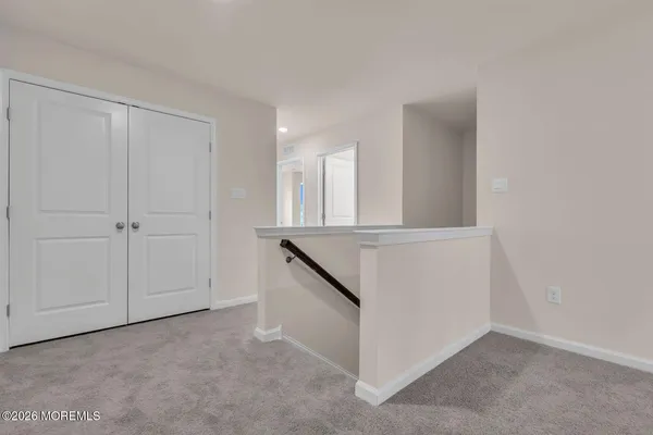 a view of a kitchen cabinets and utility room