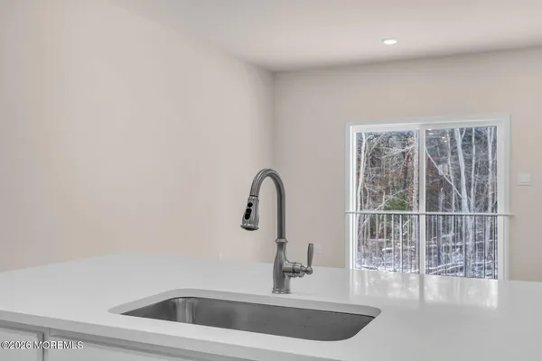 a bathroom with a sink and a window