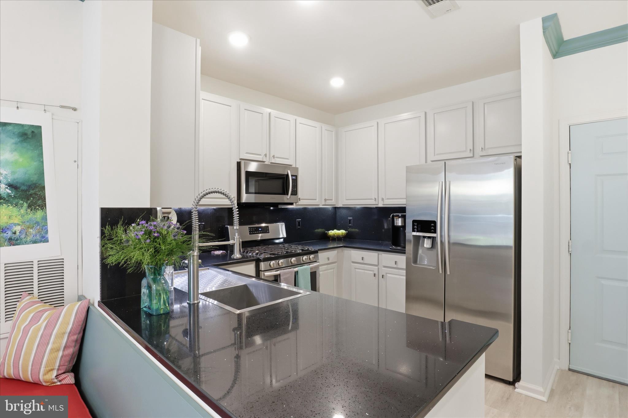 12001 Market Street, Unit 177 Reston, VA 20190 - Photo 9 of 63 Renovated Kitchen quartz counters & backsplash