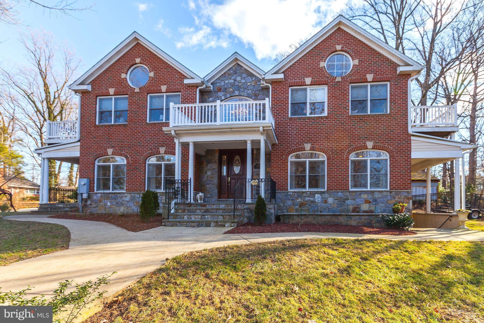 3406 Glorus Place Silver Spring, MD 20902 - Photo 1 of 53 a front view of a house with a yard