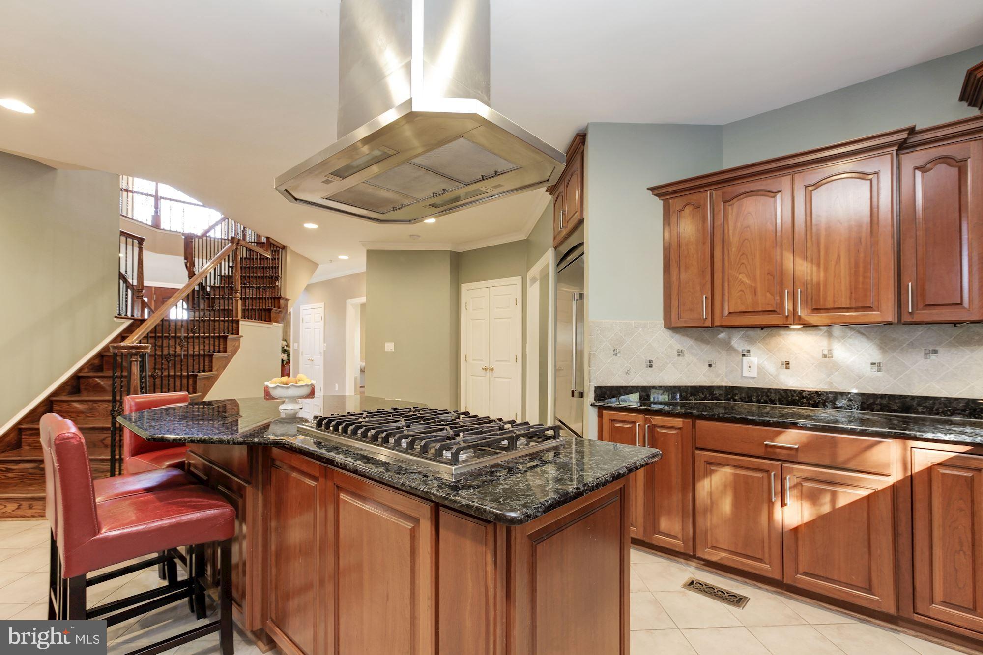 3406 Glorus Place Silver Spring, MD 20902 - Photo 15 of 53 a kitchen with stainless steel appliances granite countertop a stove and a sink