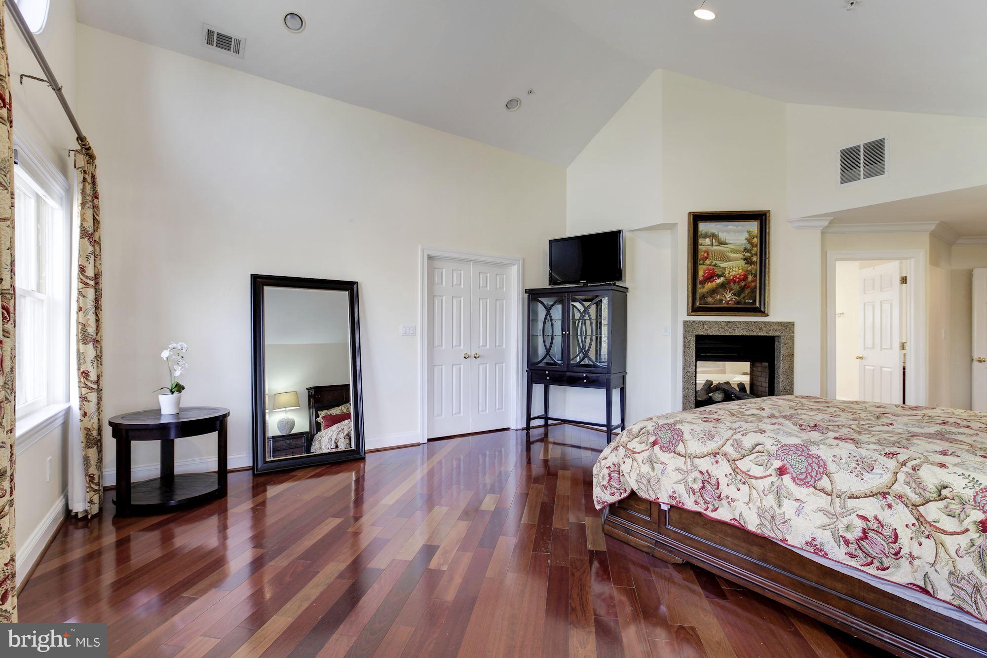 3406 Glorus Place Silver Spring, MD 20902 - Photo 24 of 53 a bedroom with a bed and wooden floor