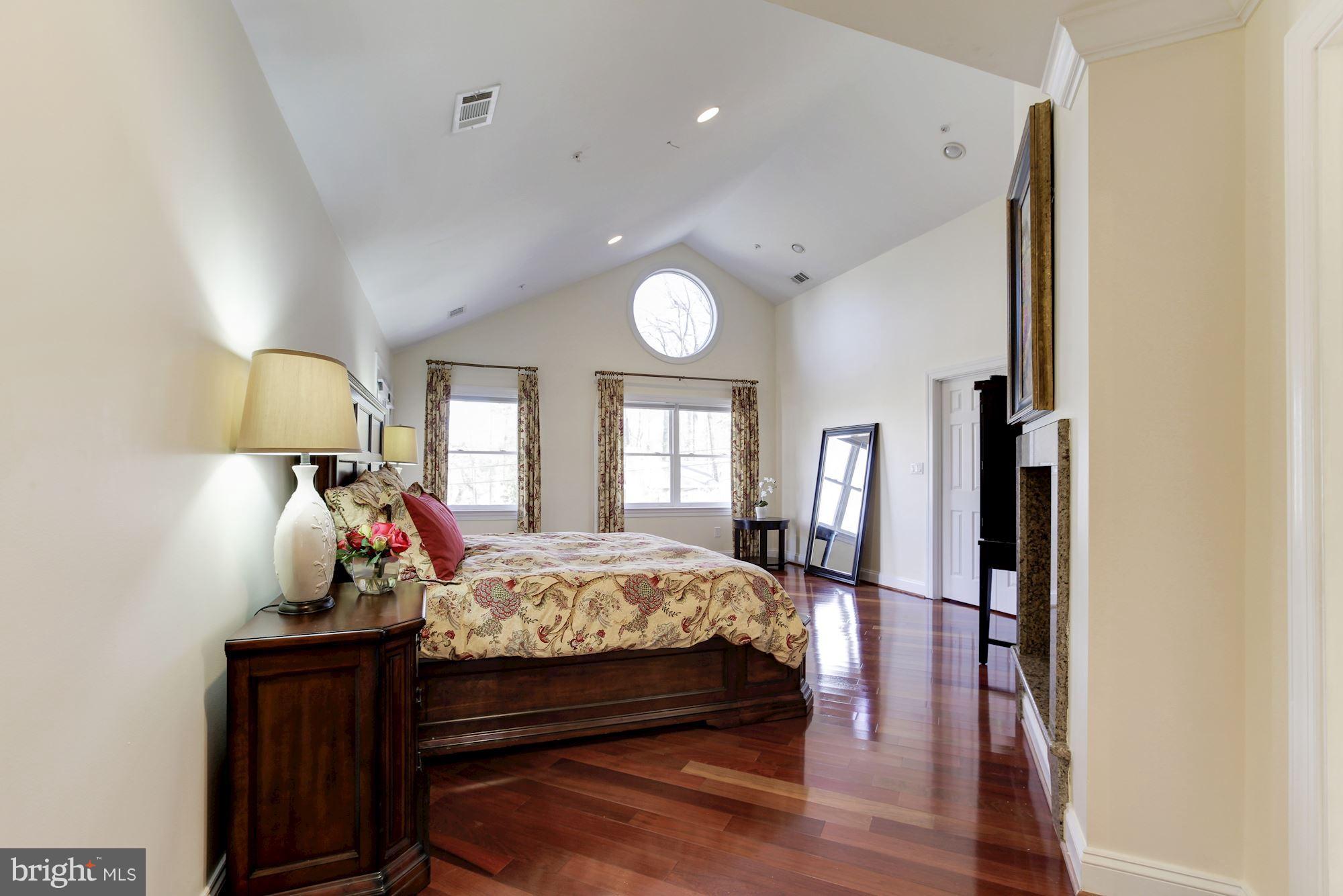 3406 Glorus Place Silver Spring, MD 20902 - Photo 25 of 53 a bed room with a bed and a lamp