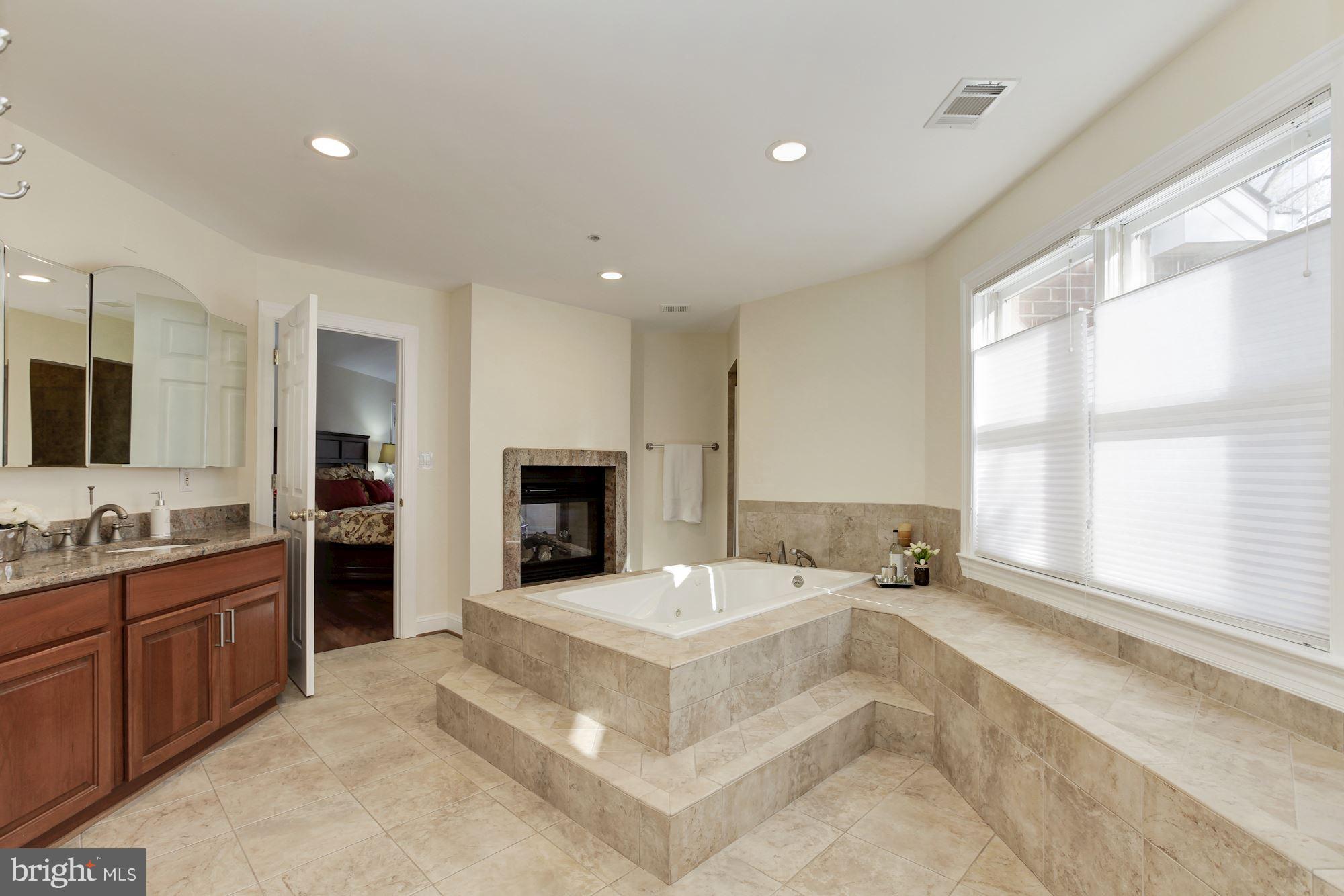 3406 Glorus Place Silver Spring, MD 20902 - Photo 26 of 53 a large white kitchen with a large window and kitchen island