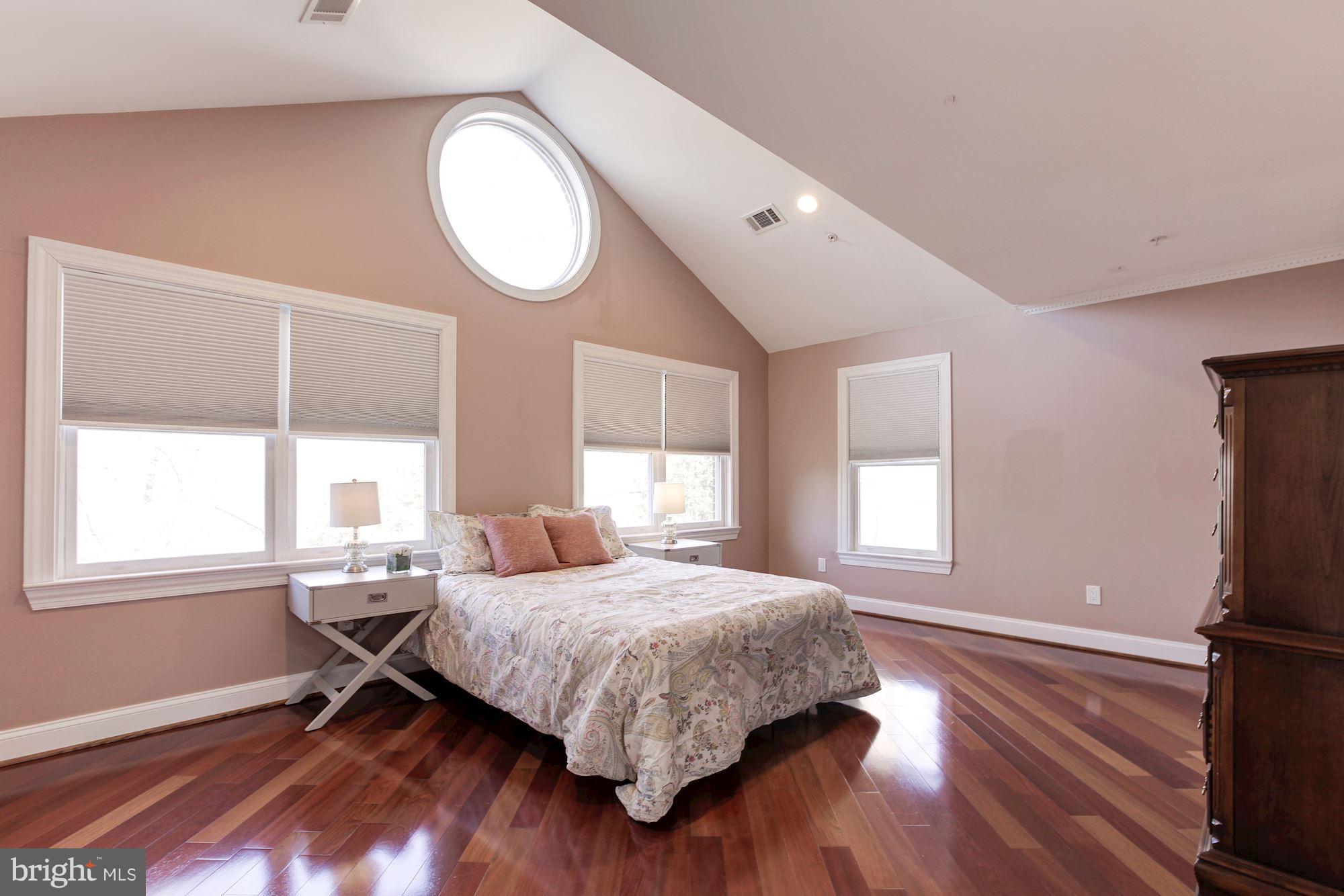 3406 Glorus Place Silver Spring, MD 20902 - Photo 39 of 53 a bedroom with a bed mirror and window