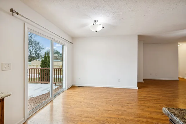 a kitchen with stainless steel appliances granite countertop a sink a stove and a microwave oven