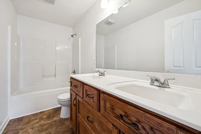 a view of a yard with a large tree