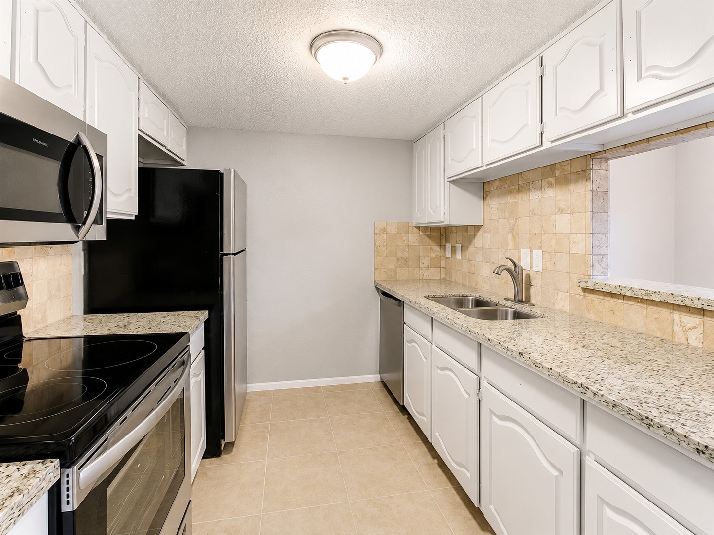 1607 Alabama Street, Unit 5 Pasadena, TX 77503 - Photo 4 of 16 Updated kitchen with Granite counters and stainless appliance