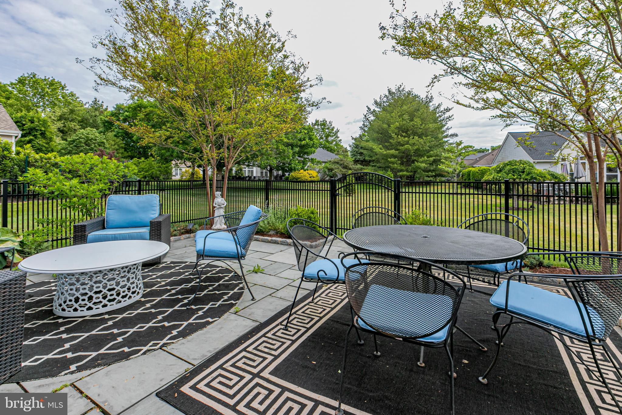 24 Foster Road Pennington, NJ 08534 - Photo 27 of 38 a view of a chairs and table on the deck